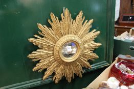 A gilt wood sunburst mirror.