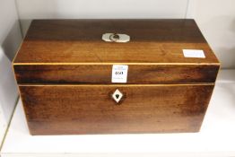 A George III mahogany tea caddy with fitted interior.