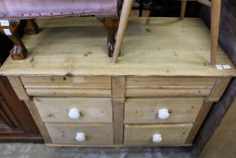 A pine chest of drawers.