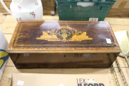 An inlaid wooden music box case.