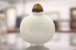 A Chinese carved jade snuff bottle.