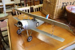 A spirit engine powered model of a bi-plane.