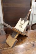 Am unusual folding coconut splitter with carved decoration.