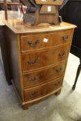 A small yew wood chest of drawers.