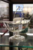 A silver-plated pedestal sugar basket with engraved decoration.