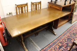 An oak refectory style dining table.