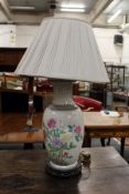 A Chinese floral decorated porcelain table lamp.