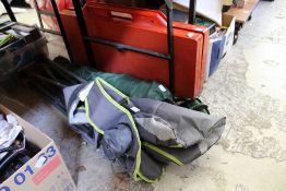 Two folding camping chairs and a folding table.