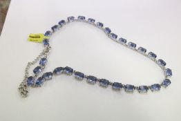 A decorative silver necklace.