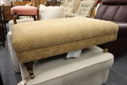 A Victorian style large upholstered foot stool.
