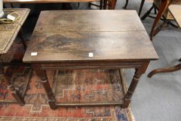 An 18th century and later oak occasional table.