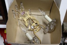 A lyre shaped ormolu two branch wall sconce.