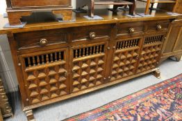 A Spanish style hardwood sideboard.