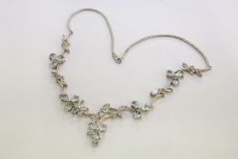 A decorative silver necklace.