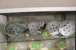 A pair of Copeland Spode plates painted with fish, four Royal Copenhagen plates and two bird
