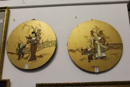 A set of four Chinese circular giltwood panels with hardstone inlaid decoration depicting figures.