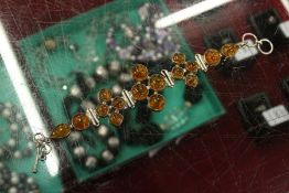 A modern silver and amber bracelet.