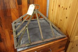 A Victorian cast iron cloche (lacking glass).