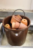 A quantity of terracotta plant pots.