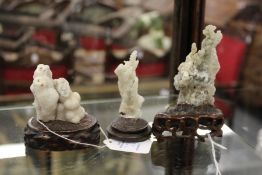 Three Chinese scholar's pieces (sea specimens) on carved wood bases.