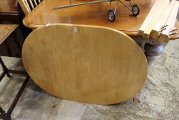 An extending kitchen table with four chairs.