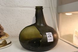 A 17th / 18th century green glass wine bottle (large portion missing).