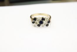 A 9ct gold, diamond and sapphire ring.