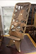 An unusual African carved wood chair.