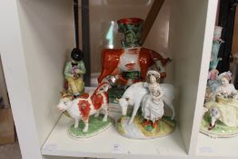 Four Staffordshire figure groups.