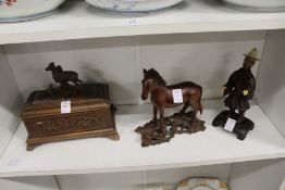A Black Forest style carved wood casket, mounted with a goat and two other items.