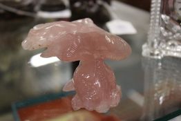 A Chinese carved rose quartz figure of a fish.