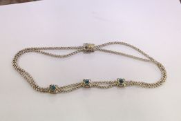 A decorative rope twist necklace.