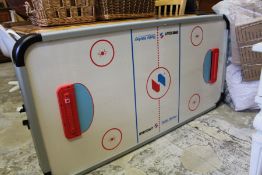 An air hockey table game.