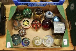 A collection of glass paperweights.