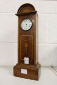 An Edwardian inlaid mahogany miniature longcase clock.
