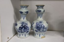A pair of Chinese transitional blue and white porcelain bottle vases.