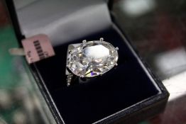 A large silver and zircon ring.