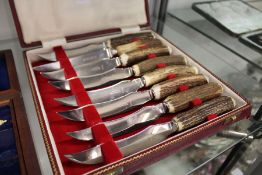 Horn handled steak knives.