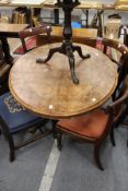 A Victorian figured walnut oval tilt top breakfast table.
