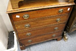 A small mahogany four drawer chest.
