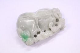 A carved jade amulet.