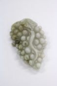A carved jade amulet.