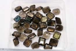 A quantity of rectangular and other tourmaline stones.