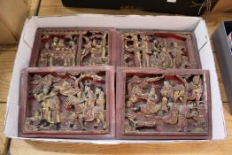 Four small Chinese carved and gilded decorated panels.