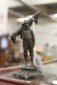 A small bronze figure of a fisherman.