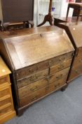A George III oak bureau.