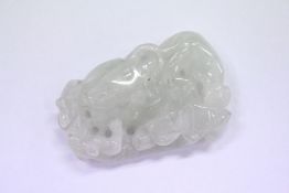 A carved jade amulet.
