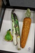 Four pottery and glass moulded fruit and vegetables.