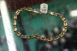 A silver line bracelet.