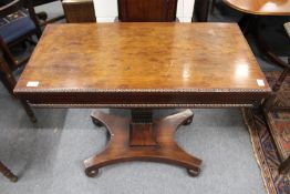 A good 19th century mahogany rectangular foldover card table on a carved column support with